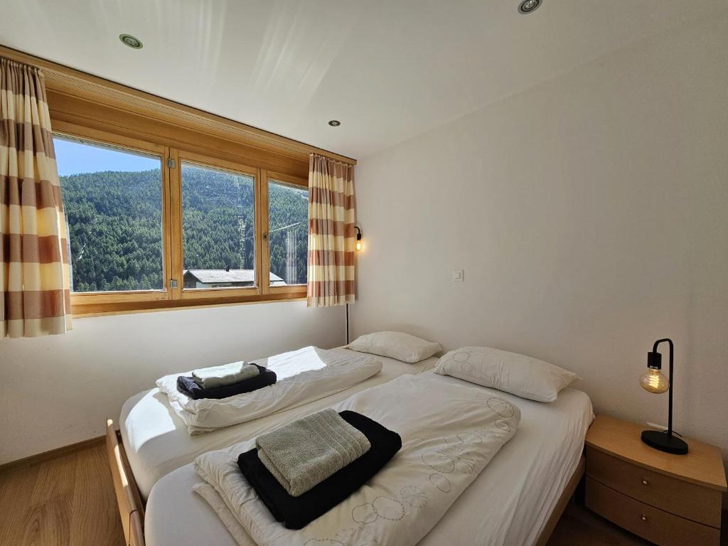 Postel nebo postele na pokoji v ubytování Aramis Lodge