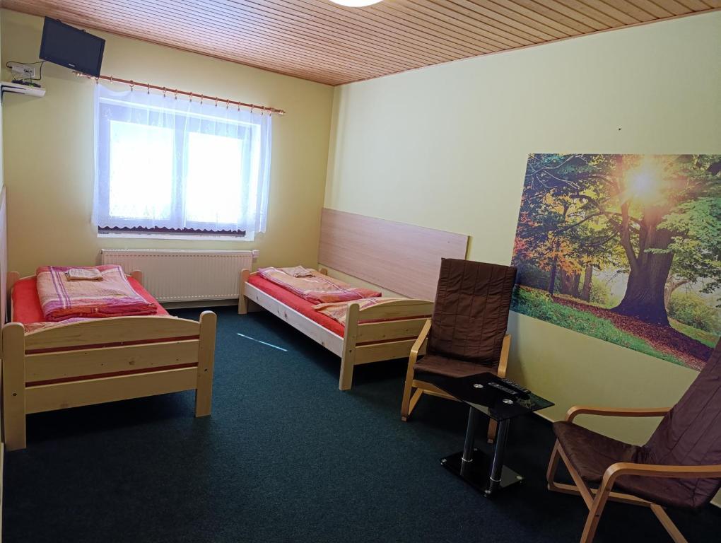 Łóżko lub łóżka w pokoju w obiekcie Pavilon v ráji