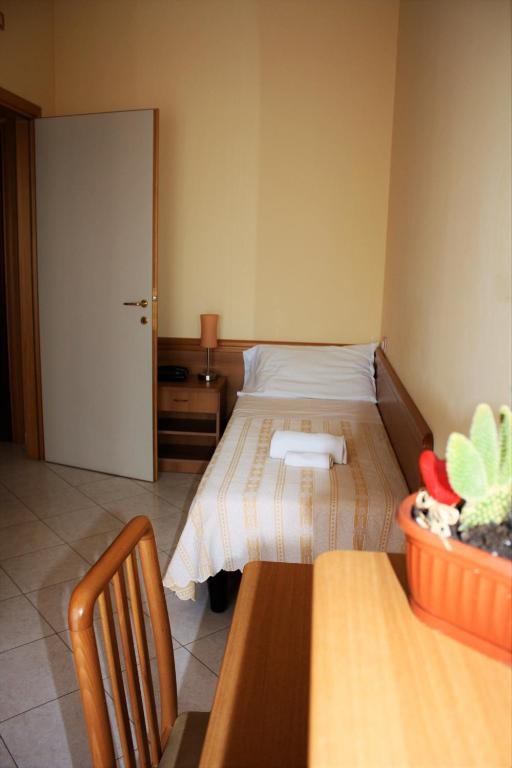 Postel nebo postele na pokoji v ubytování Hotel San Giorgio