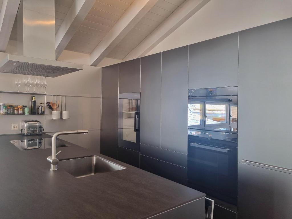 Kuchyň nebo kuchyňský kout v ubytování Duplex Apartment Bella Coppia