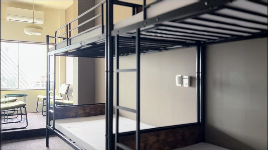 Postel nebo postele na pokoji v ubytování Arashima Hostel