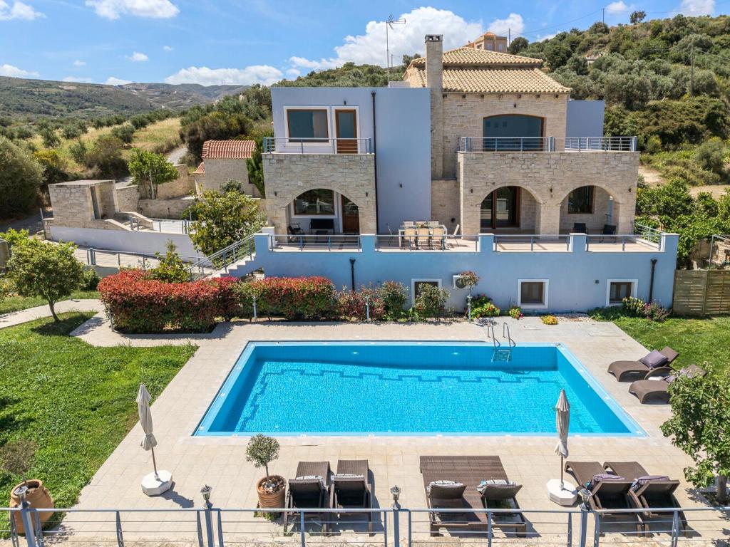 an image of a villa with a swimming pool at Arios Lux Villa in Ayía Paraskeví
