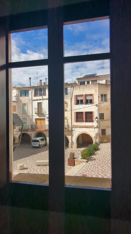 a view of a city from a window at L'Artesania - The Craft village house in Albí