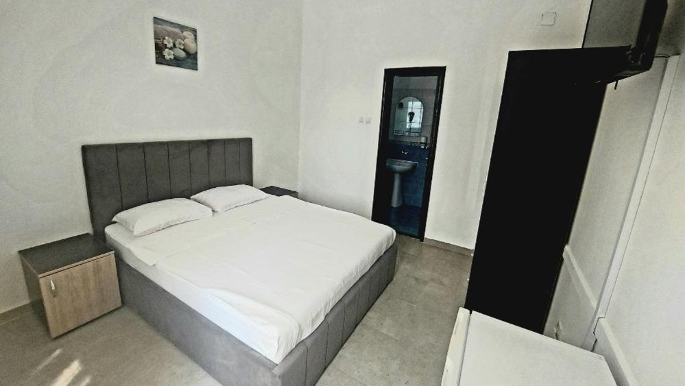 Postel nebo postele na pokoji v ubytování La Perla Bianca Residence