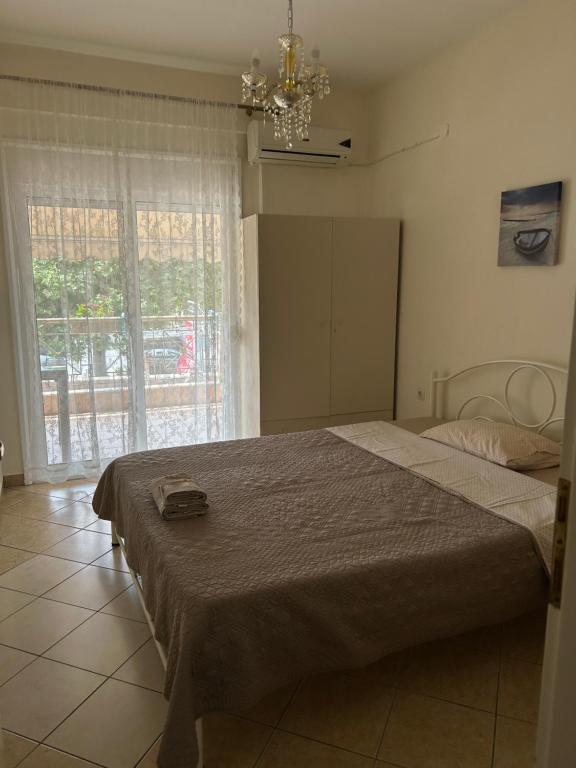 Postel nebo postele na pokoji v ubytování Sofi's Seaside