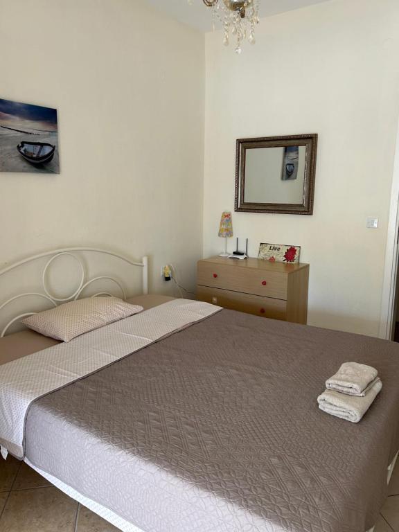 Postel nebo postele na pokoji v ubytování Sofi's Seaside