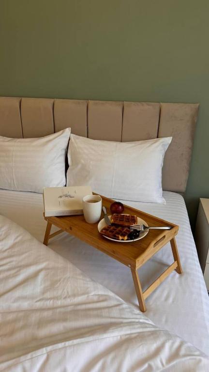 a tray of food sitting on top of a bed at Rent House Dilijan in Dilijan