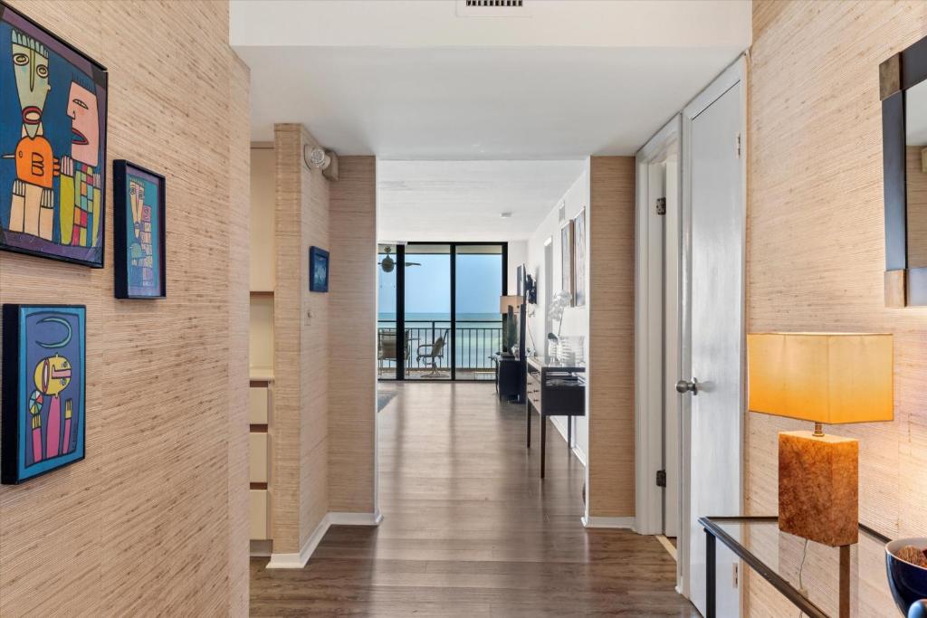 a hallway with a view of the ocean at Beach Club Siesta #104 in Key West