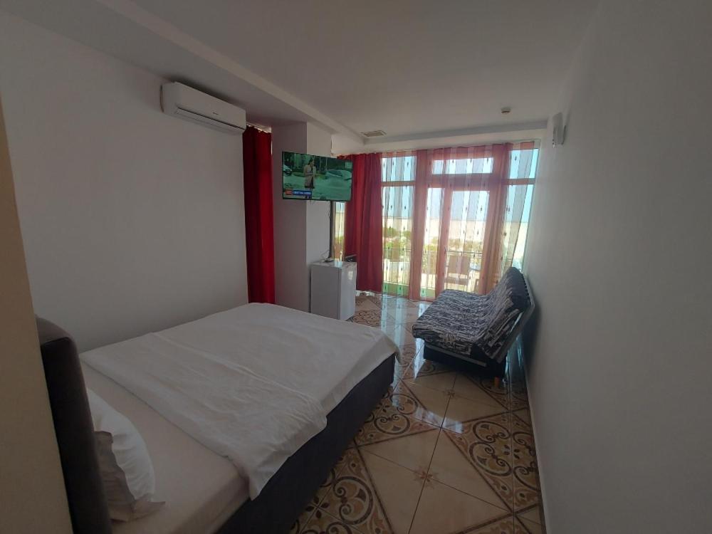 Postel nebo postele na pokoji v ubytování La Perla Bianca Residence