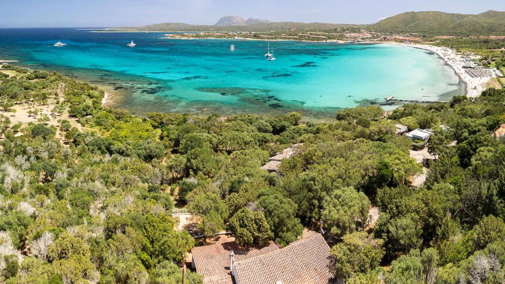 an aerial view of a beach with boats in the water at Welcomely - Sa Prenda in Marinella