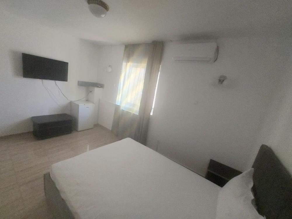 TV a/nebo společenská místnost v ubytování La Perla Bianca Residence