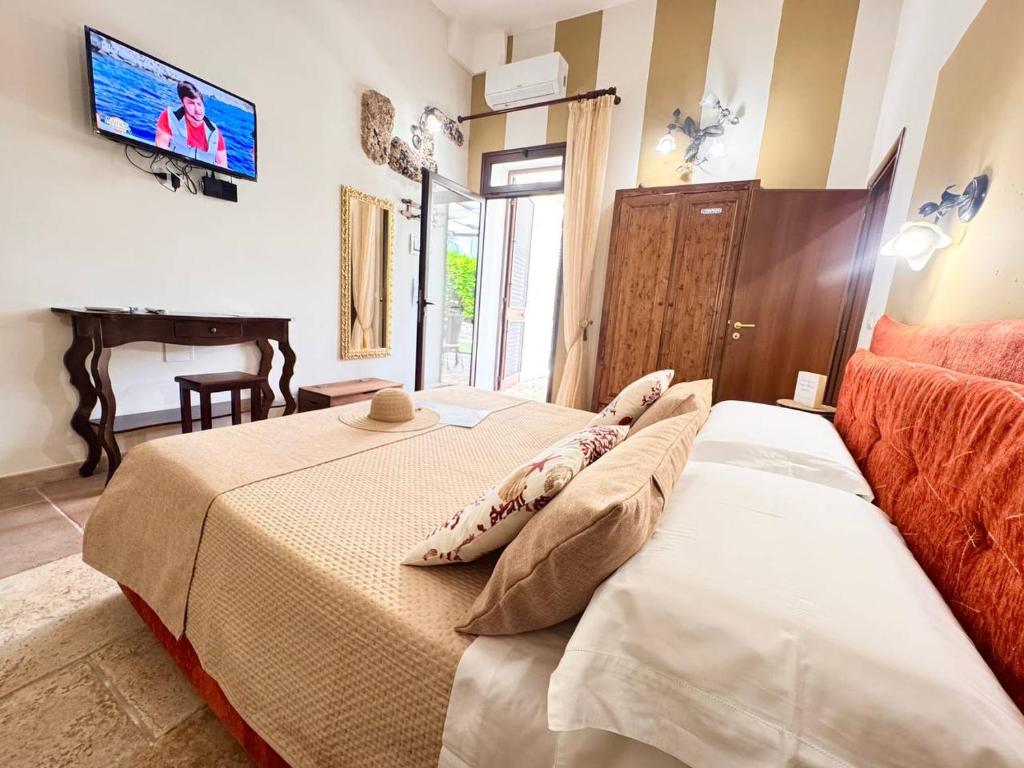 Posteľ alebo postele v izbe v ubytovaní Villa B&B Antiche Macine del Salento - nel cuore del Salento