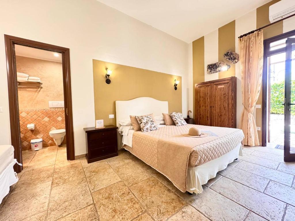 Posteľ alebo postele v izbe v ubytovaní Villa B&B Antiche Macine del Salento - nel cuore del Salento