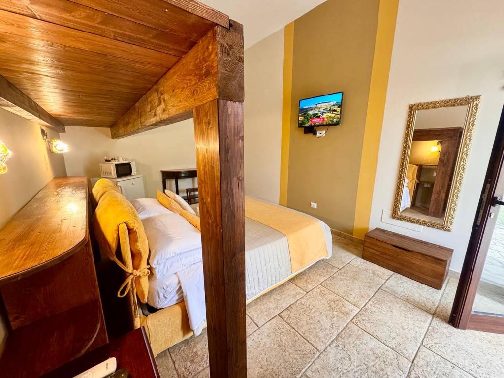 Posteľ alebo postele v izbe v ubytovaní Villa B&B Antiche Macine del Salento - nel cuore del Salento