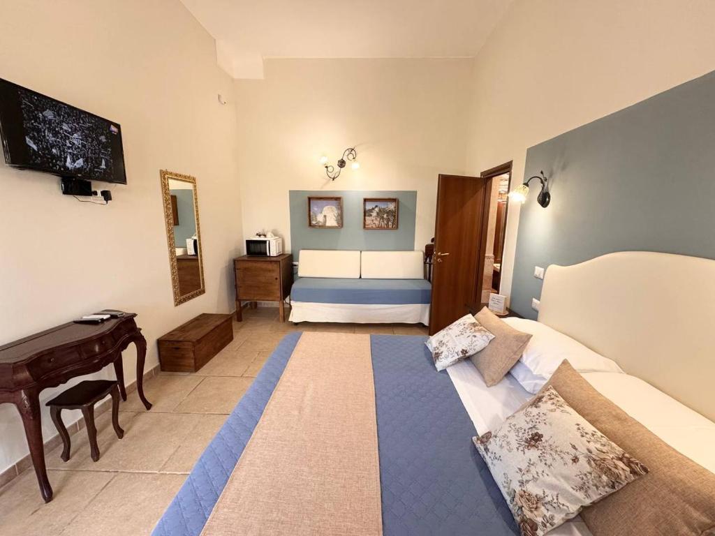 Posteľ alebo postele v izbe v ubytovaní Villa B&B Antiche Macine del Salento - nel cuore del Salento