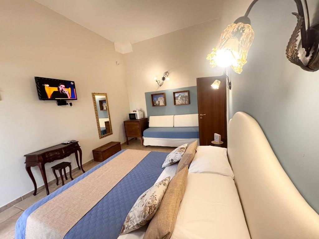 Posteľ alebo postele v izbe v ubytovaní Villa B&B Antiche Macine del Salento - nel cuore del Salento