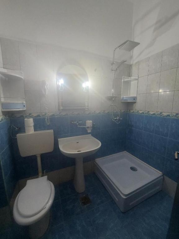 Koupelna v ubytování La Perla Bianca Residence