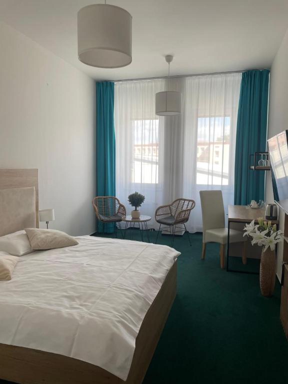 Postel nebo postele na pokoji v ubytování Sareza hotel