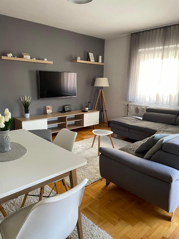 a living room with a couch and a table at Cista DESETKA 2 in Požarevac