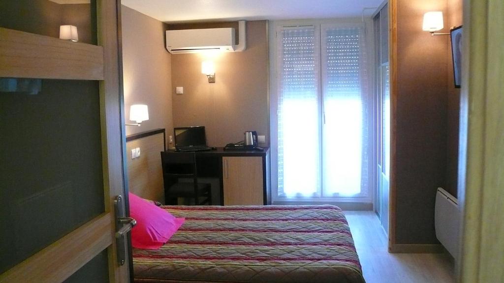 Postel nebo postele na pokoji v ubytování Hôtel L'Européen