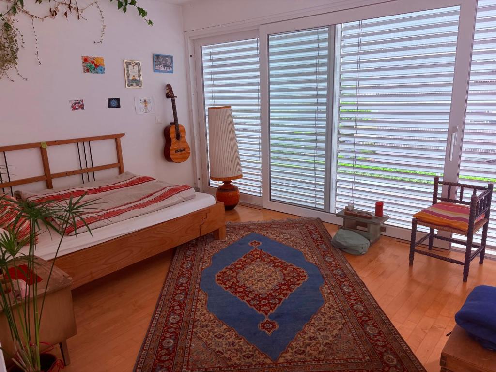 Postel nebo postele na pokoji v ubytování Loft Bottighofen