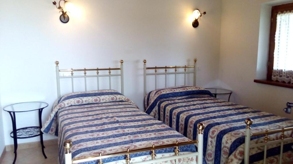 Posteľ alebo postele v izbe v ubytovaní Agriturismo La Chiocciola