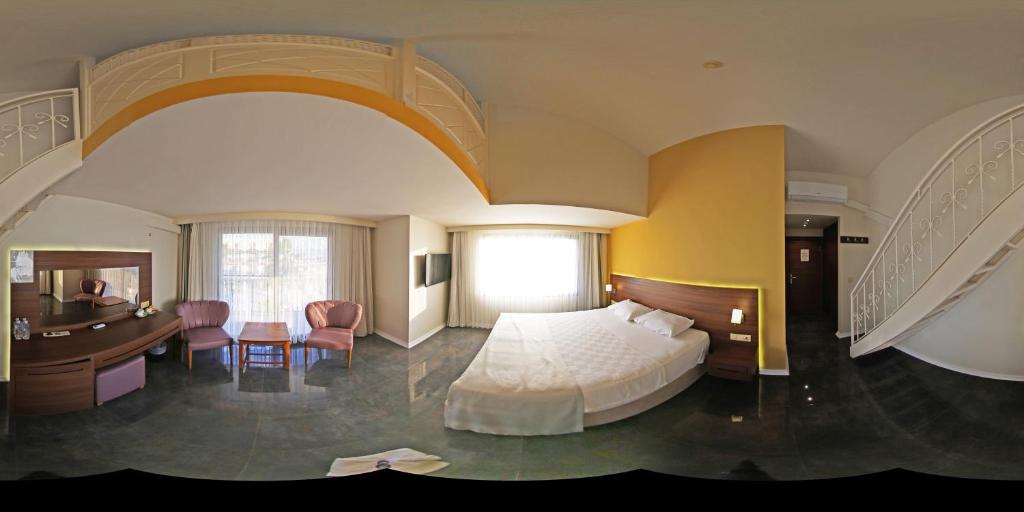Postel nebo postele na pokoji v ubytování Neopol Hotel
