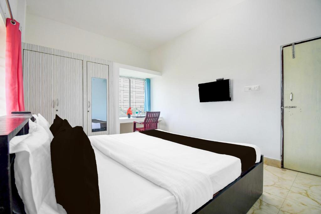 Postel nebo postele na pokoji v ubytování Super Hotel O Dumduma Near DN Regalia Mall