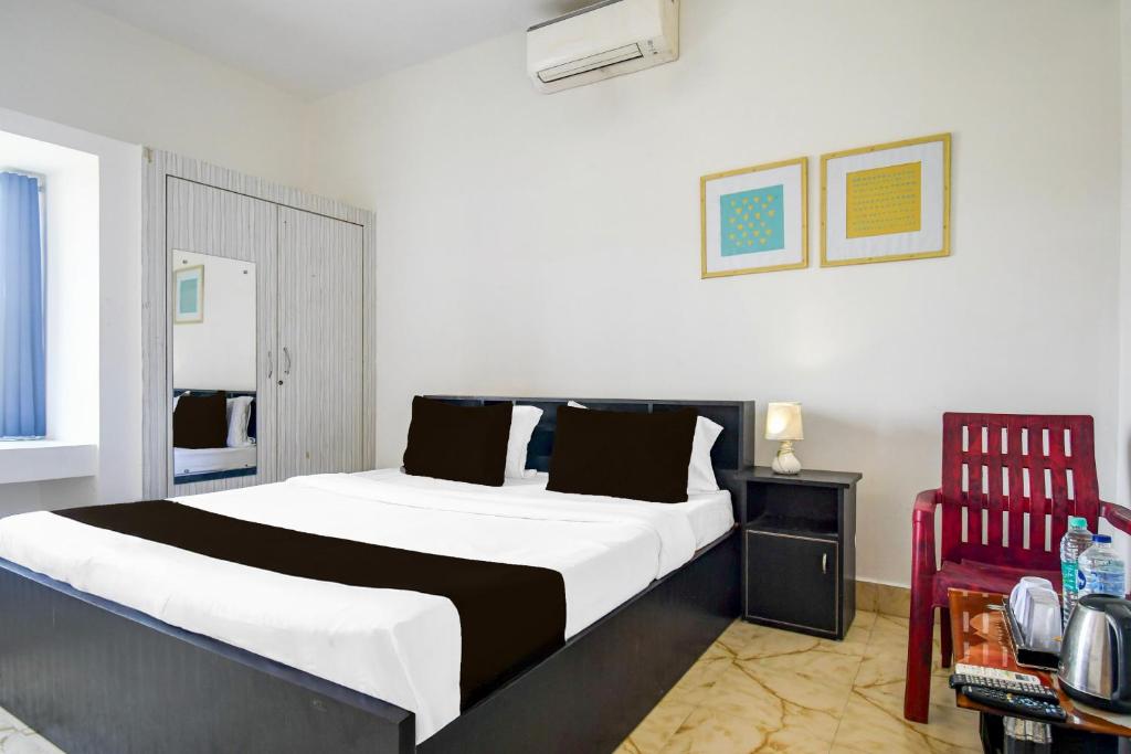 Postel nebo postele na pokoji v ubytování Super Hotel O Dumduma Near DN Regalia Mall