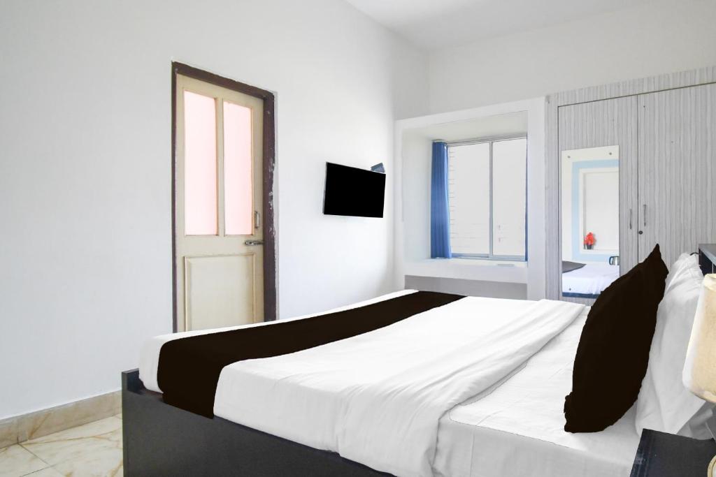 Postel nebo postele na pokoji v ubytování Super Hotel O Dumduma Near DN Regalia Mall