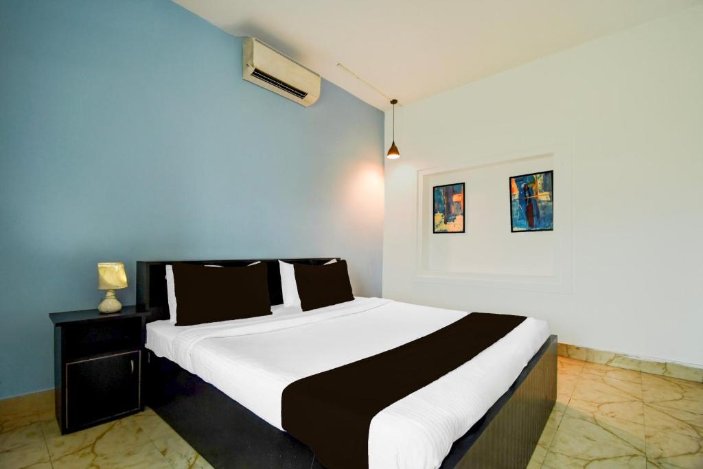 Postel nebo postele na pokoji v ubytování Super Hotel O Dumduma Near DN Regalia Mall