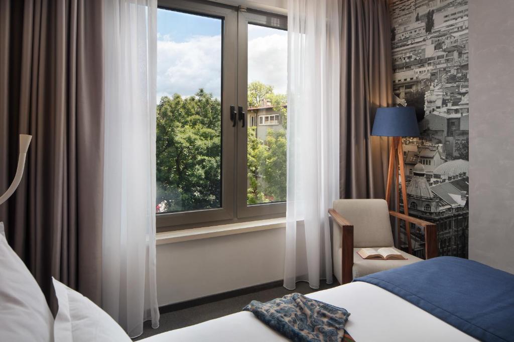 Postel nebo postele na pokoji v ubytování Hotel Colors Inn