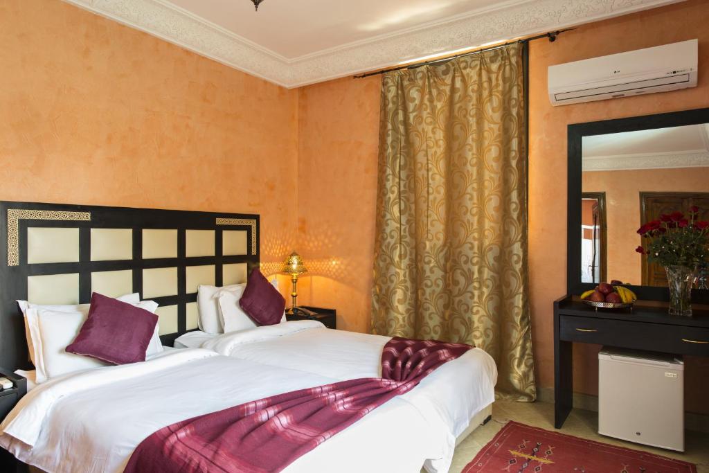 Postel nebo postele na pokoji v ubytování Marrakech House