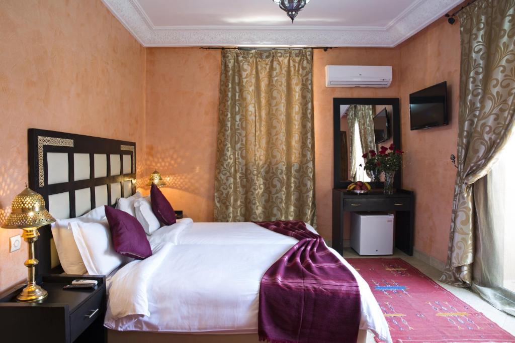 Postel nebo postele na pokoji v ubytování Marrakech House