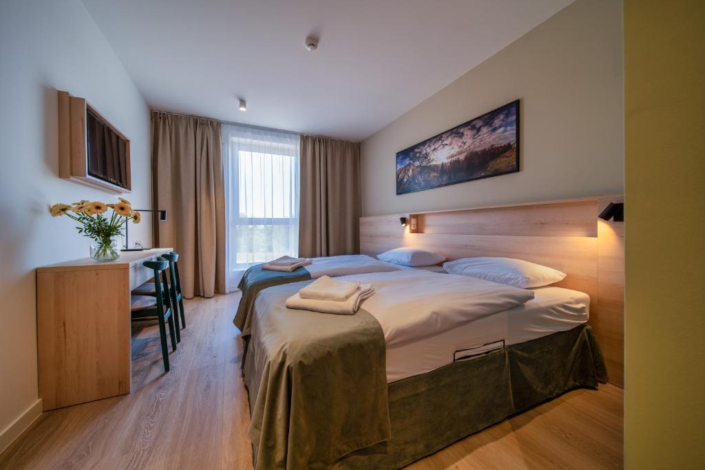 Postel nebo postele na pokoji v ubytování Osada Zborów Camp & Bed