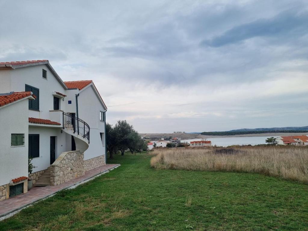 a house with a view of the water at Superior apartment Nina in Povljana