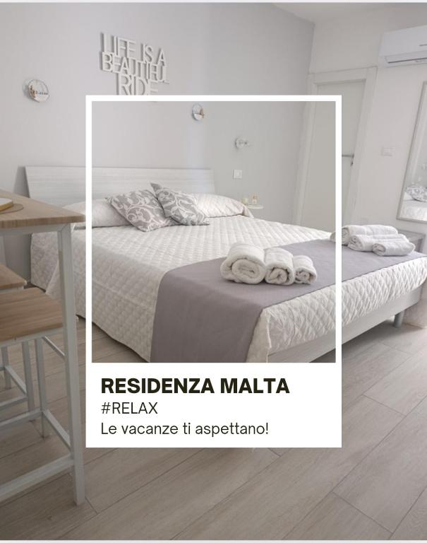 Ένα ή περισσότερα κρεβάτια σε δωμάτιο στο Residenza Malta