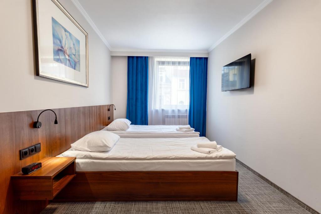 Posteľ alebo postele v izbe v ubytovaní Hit Apartments
