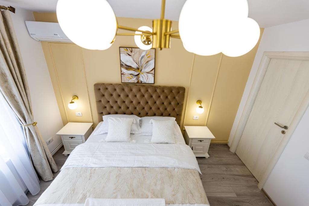 Giường trong phòng chung tại Vila Petersdorf