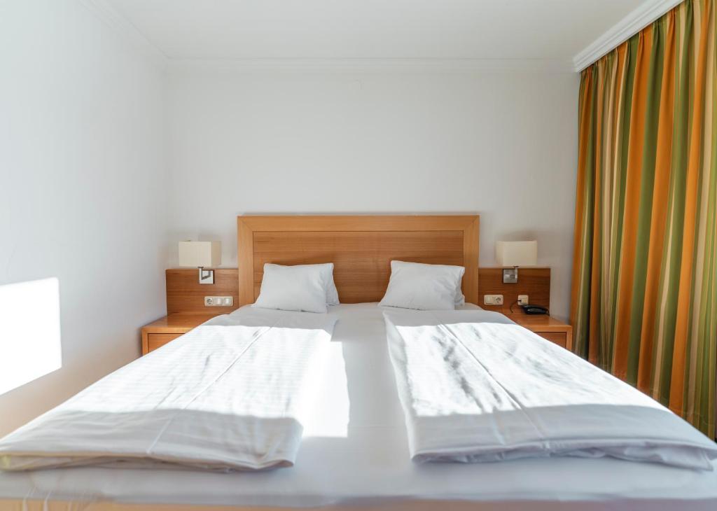 Posteľ alebo postele v izbe v ubytovaní Genusshotel Fichtenhof