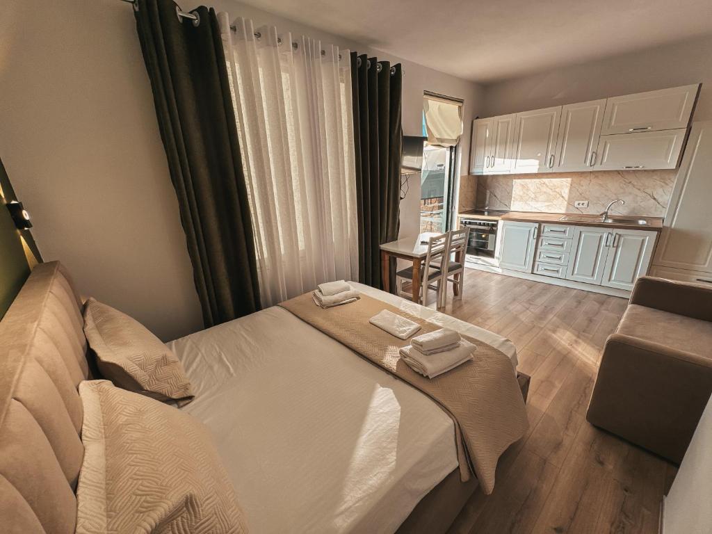 Postel nebo postele na pokoji v ubytování Relaxx Apartment & Hotel