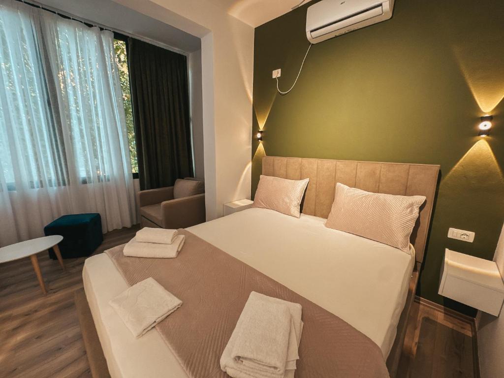 Postel nebo postele na pokoji v ubytování Relaxx Apartment & Hotel