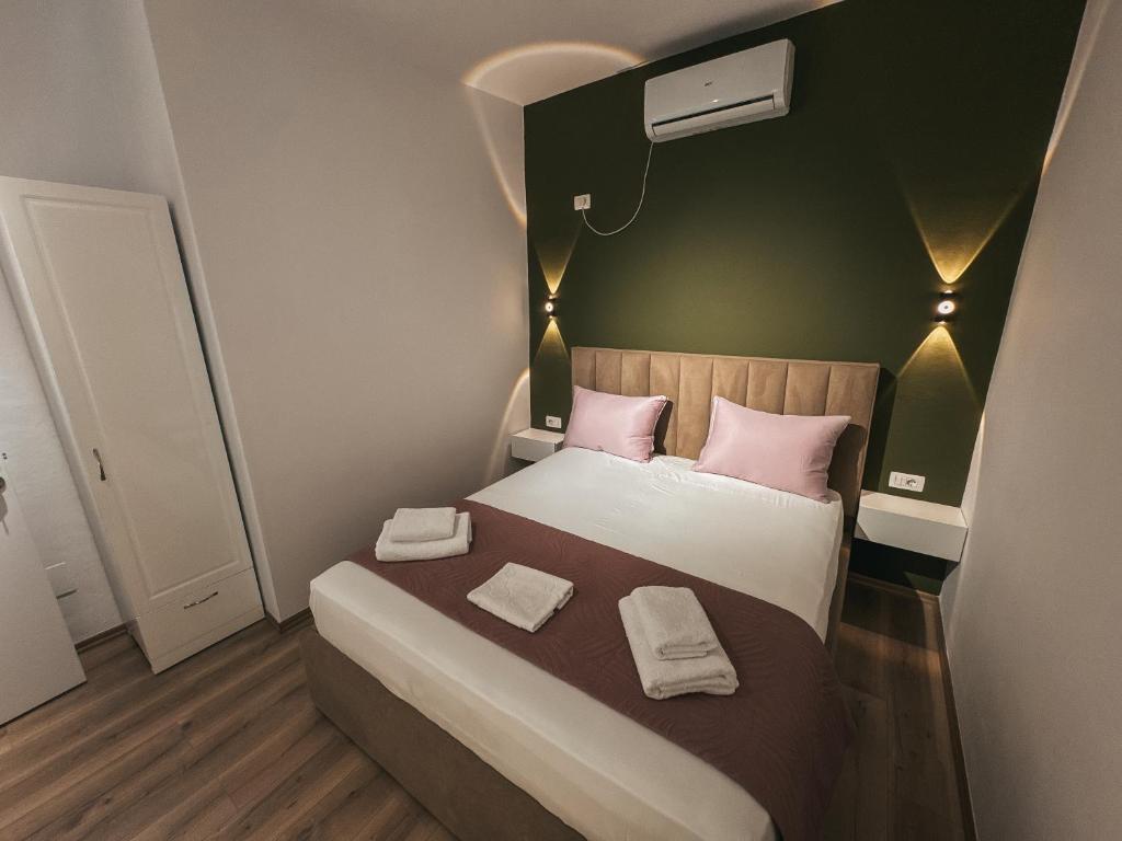 Postel nebo postele na pokoji v ubytování Relaxx Apartment & Hotel