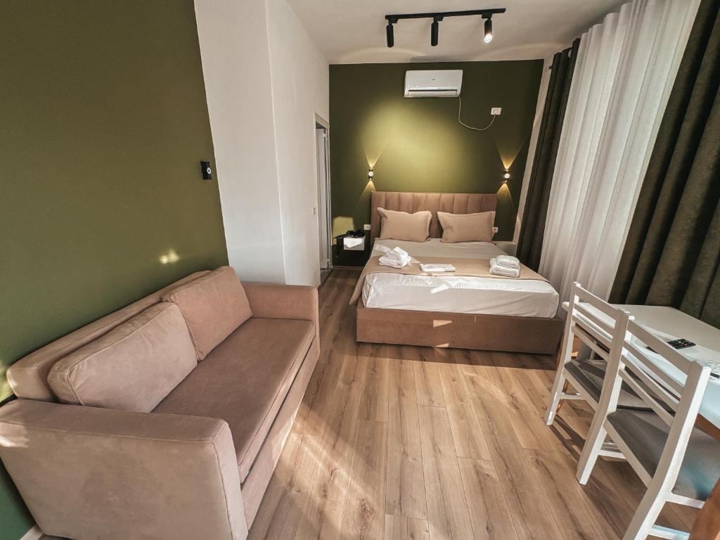 Postel nebo postele na pokoji v ubytování Relaxx Apartment & Hotel