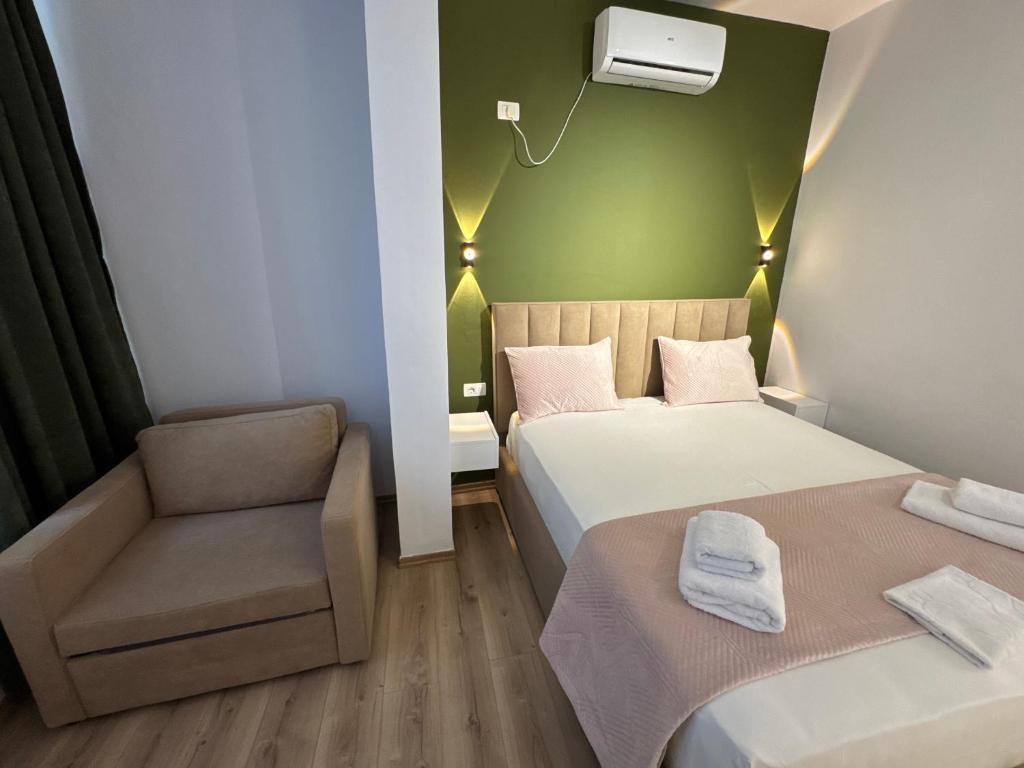 Postel nebo postele na pokoji v ubytování Relaxx Apartment & Hotel