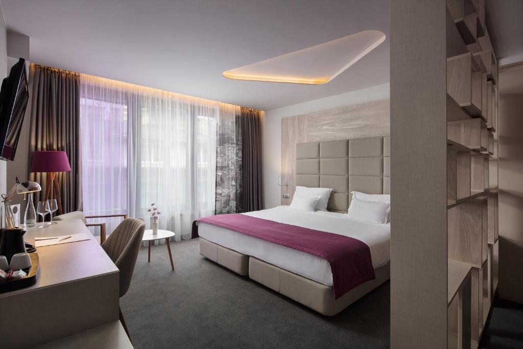 Postel nebo postele na pokoji v ubytování Hotel Colors Inn