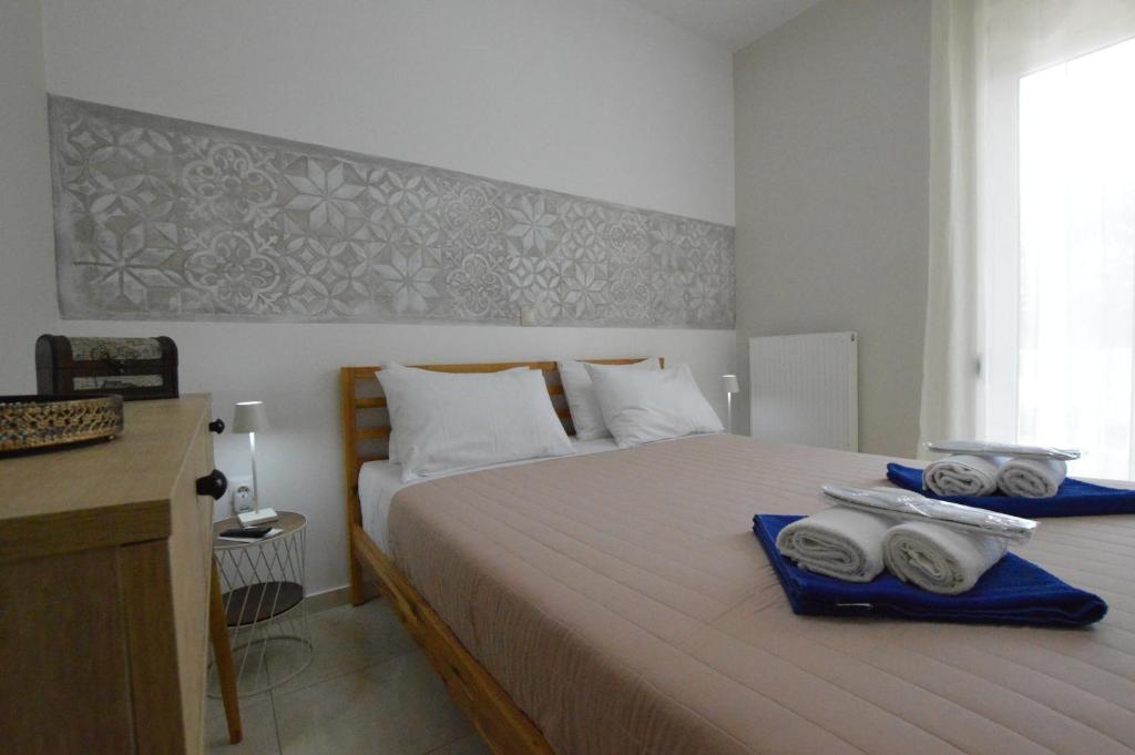 Postel nebo postele na pokoji v ubytování Harmony Apartments