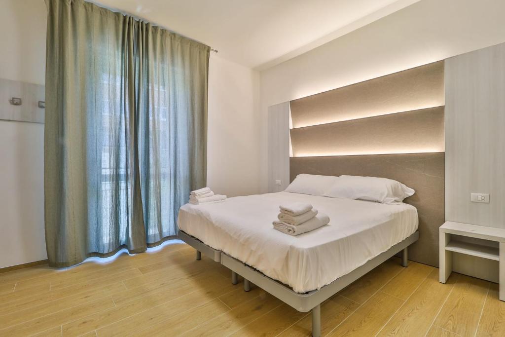 Ένα ή περισσότερα κρεβάτια σε δωμάτιο στο Mazzini Rooms