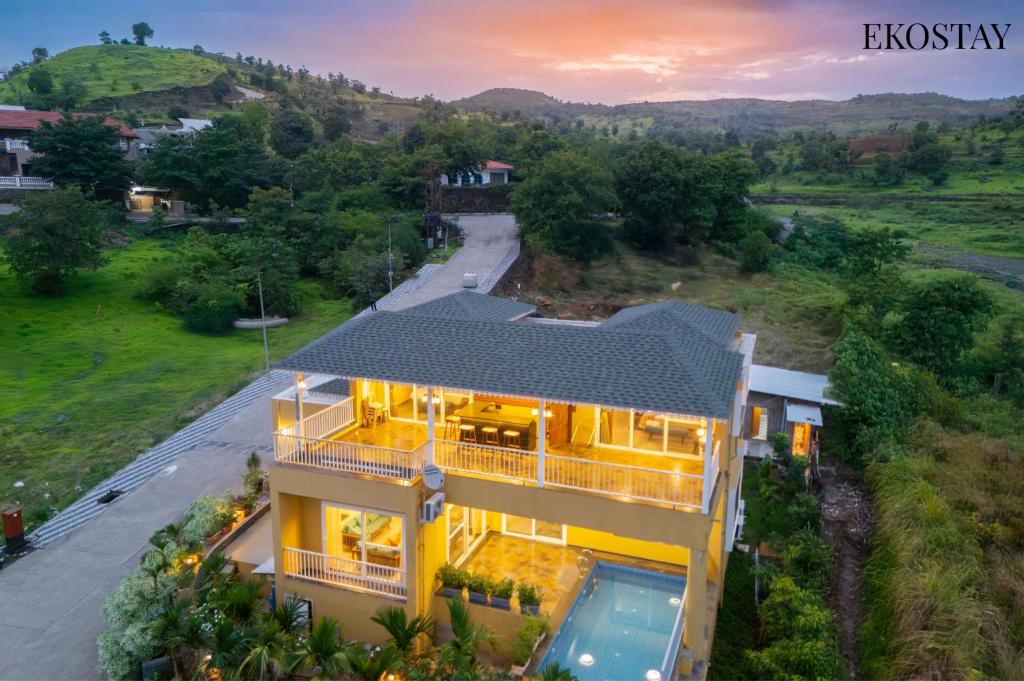 an overhead view of a house with a sunset at EKOSTAY - Casa Den in Igatpuri