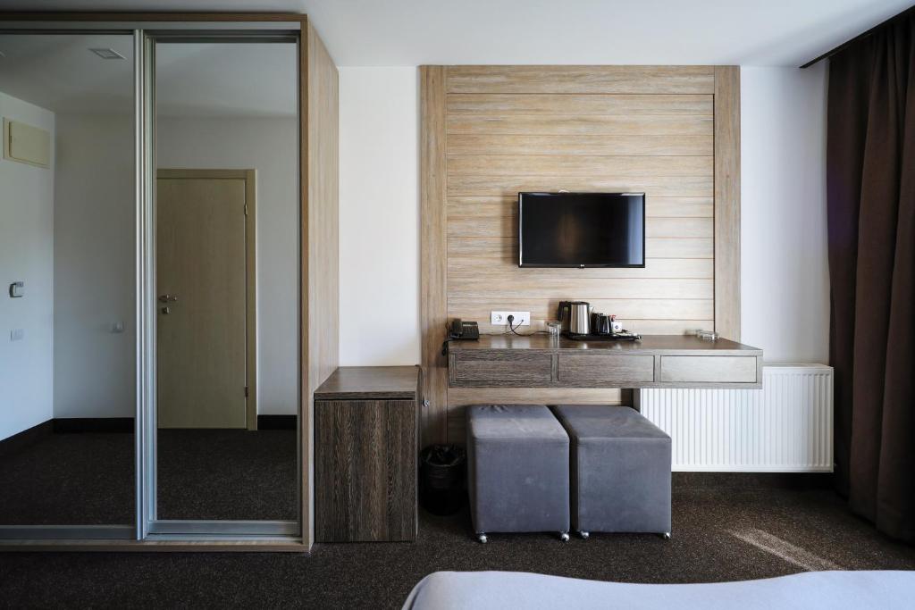 TV a/nebo společenská místnost v ubytování VILSON hotel